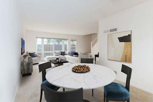A dining room with a white table and chairs at Hillsdale Garden Apartments, San Mateo, CA