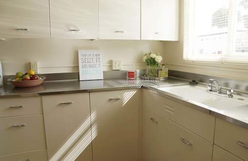 a kitchen with white cabinets and a sink at Hillsdale Garden Apartments, San Mateo, CA 94403