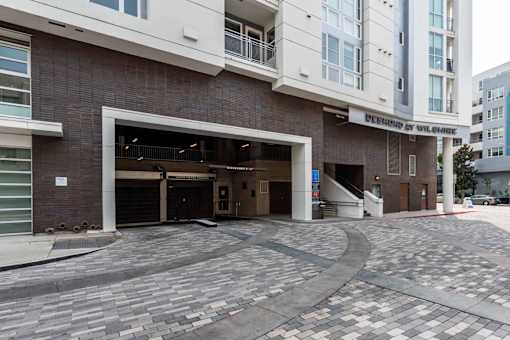 A building with a garage door open in front of it.