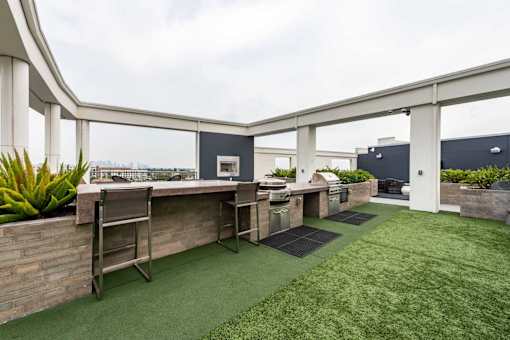A patio with a table and chairs.