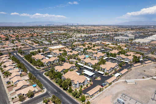 A suburban neighborhood with a road running through it.