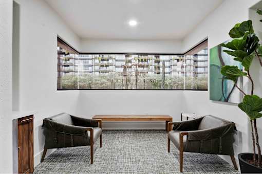a room with two chairs and a table