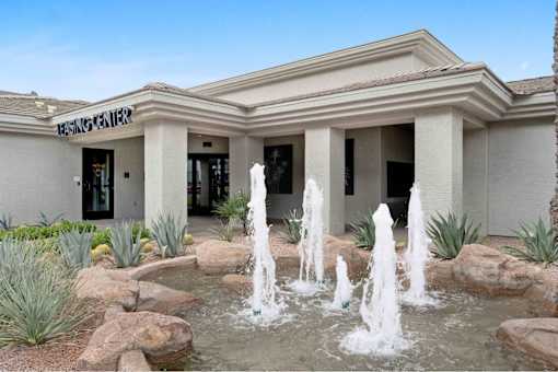 a fountain in front of a building
