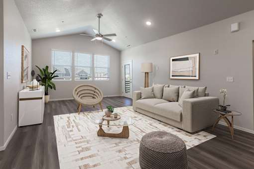 A living room with a couch, chair, and table.