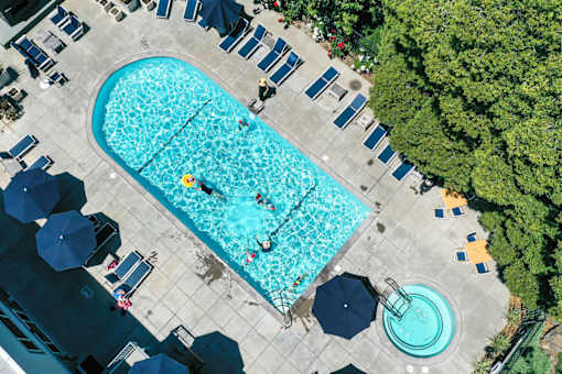 A large swimming pool with people in it.