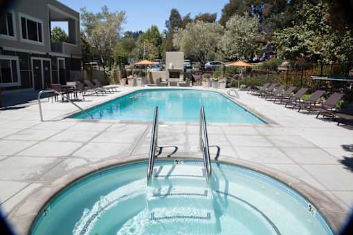 A swimming pool with a ladder in the middle of it.