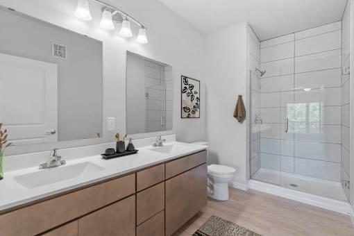 A bathroom with a white sink and a toilet.
