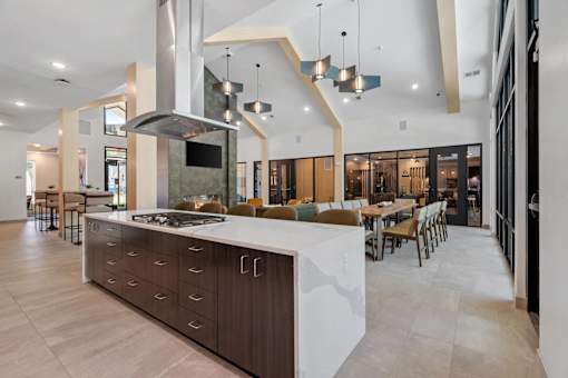 A modern kitchen with a large island and a range hood.