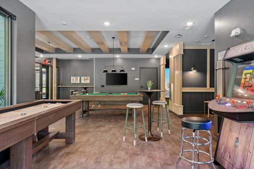A bar area with a pool table and a shelf with canisters.