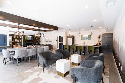 A modern living room with grey and white furniture.