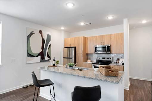 Well-appointed kitchen with island and granite countertops