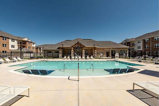 Resort-style pool with lounge chairs