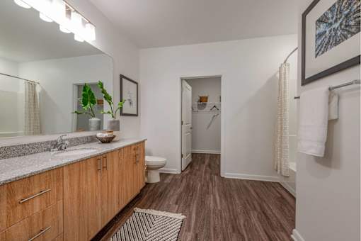 Spacious bathroom with dual sinks and ample storage
