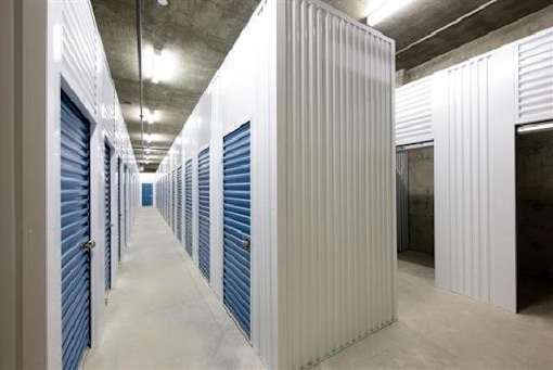 A long hallway with a series of storage units on either side.