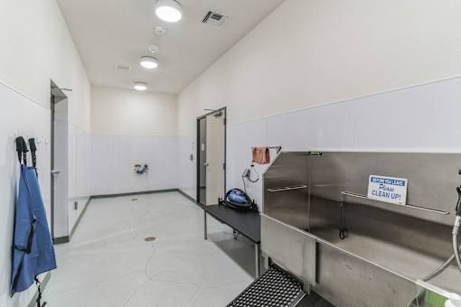 A cleaning station with a sign that says