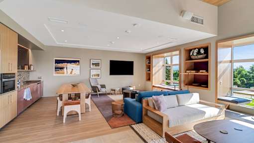 A modern living room with a wooden floor and furniture.