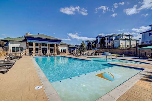 A swimming pool with a yellow logo on the side.