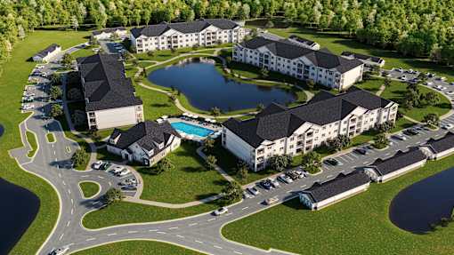 Aerial view of Lakeview Terrace apartments in Ridgeland, SC featuring the community pool, landscaped grounds, and surrounding walkways.