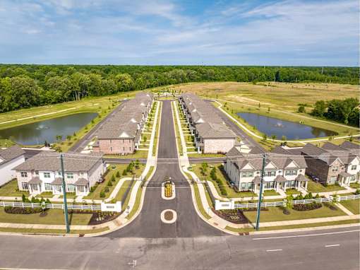 A suburban neighborhood with a roundabout in the center.