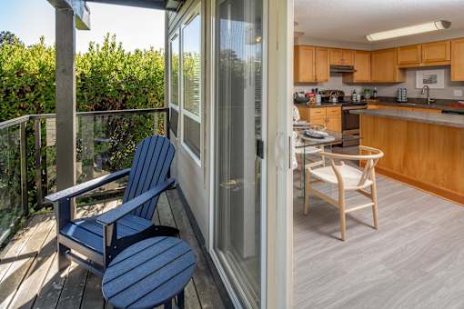 a composite image of a living room and a kitchen with blue benches