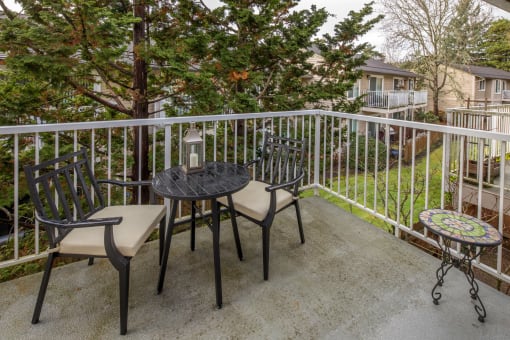 Patio with a table and chairs on a balcony at Summerfield, Tigard, OR, 97224