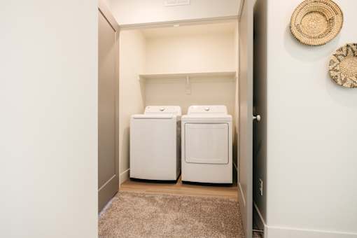 A laundry room with a washer and dryer.