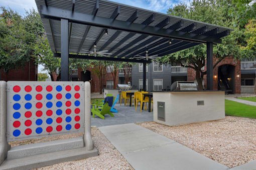 An outdoor lounge area with yard games.