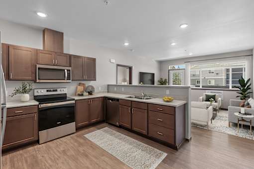 A modern kitchen with brown cabinets and a white countertop.