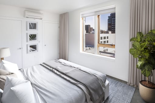 Bedroom with a bed and a window