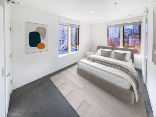 Bedroom with a bed and two windows