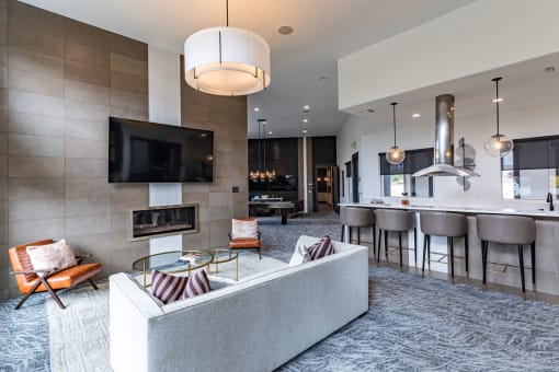 a living room with a couch and a table with chairs