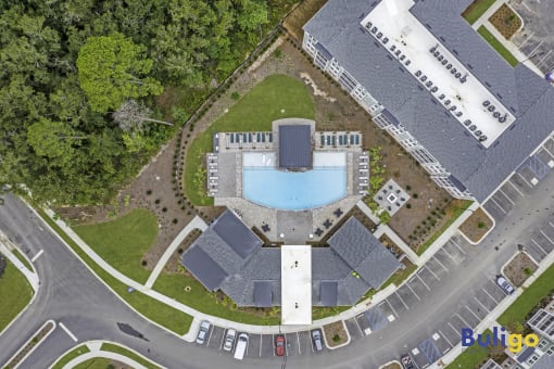 a birds eye view of a building with a pool