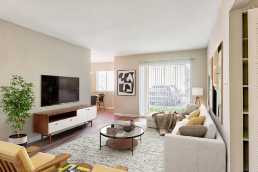a living room with beige walls and a large window with a sliding glass door