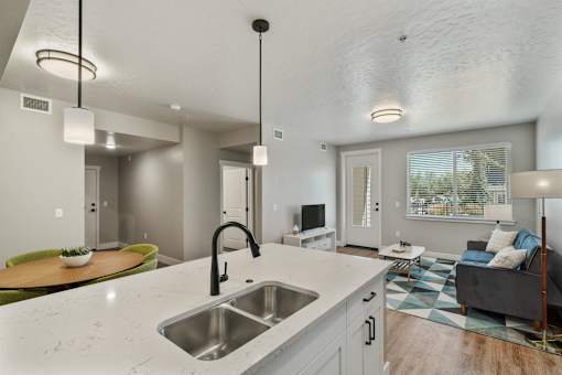 A modern kitchen with a large island and a sink.