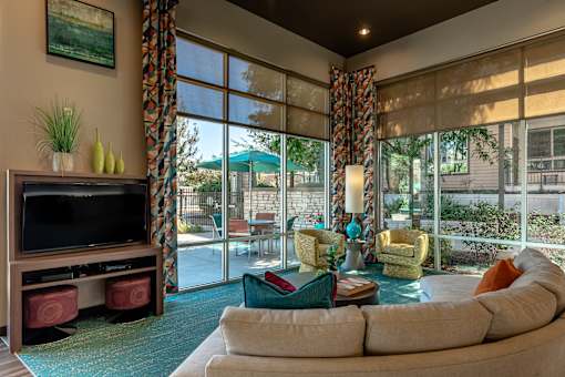 A living room with a television and a couch.