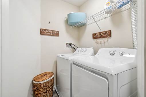 A laundry room with a washer and dryer.