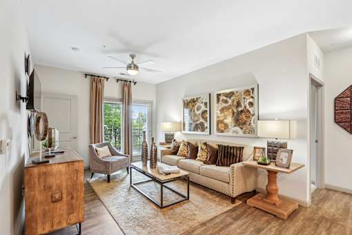 A living room with a couch, armchair, and coffee table.