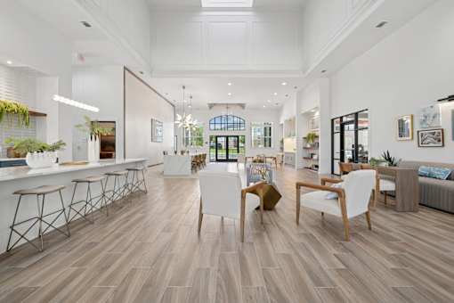 A modern living room with wooden floors and furniture.
