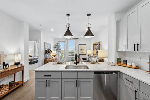 A kitchen with a large island and a sink.