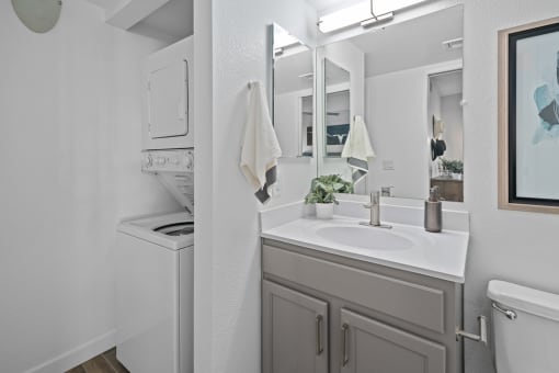 our apartments offer a bathroom with a sink and a washer and dryer