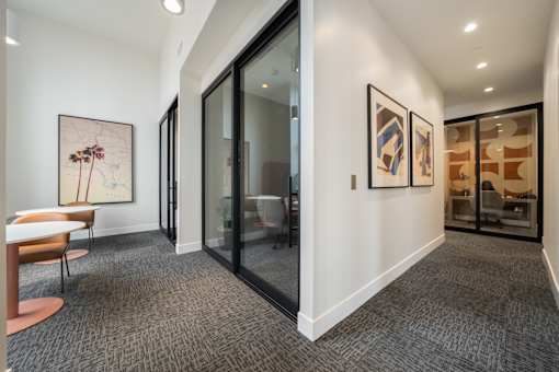 A room with a carpeted floor and a chair.