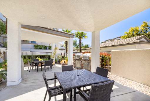 A patio with a table and chairs is shown.