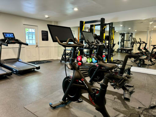 a gym full of exercise bikes and other fitness equipment