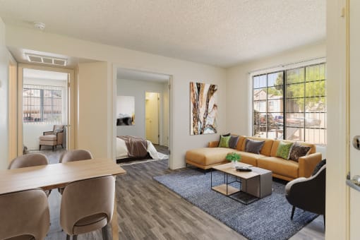 an open living room and dining room with a couch and a table