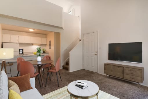 a living room with a couch and a table and a television