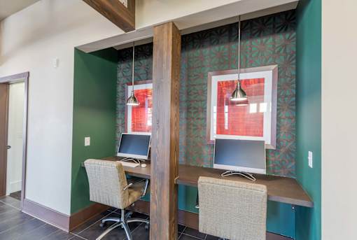 A room with a desk and a computer.