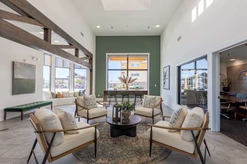A living room with a green wall and a large window.