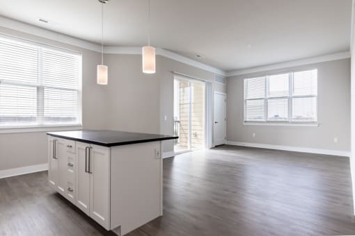 an empty kitchen and living room in an apartment