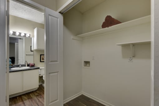 a kitchen with a sink and a mirror in a 555 waverly unit