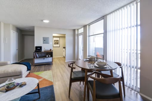 a living room and dining area in a 555 waverly unit